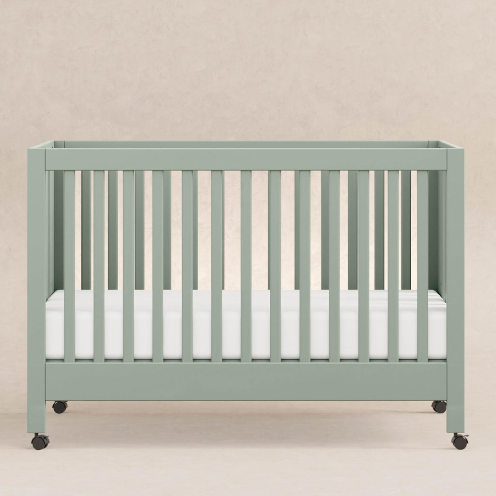 Babyletto Maki Full-Size 2-in-1 Portable Folding Crib with Toddler Bed Conversion Kit in Light Sage, Greenguard Gold Certified