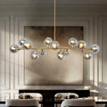 Lzawvm Linear Chandeliers Dining Room Gold Sputnik Chandelier 13-Lights Modern Glass Globe Chandelier 59 Inch 13 Lights Linear Dining Room Light Fixture