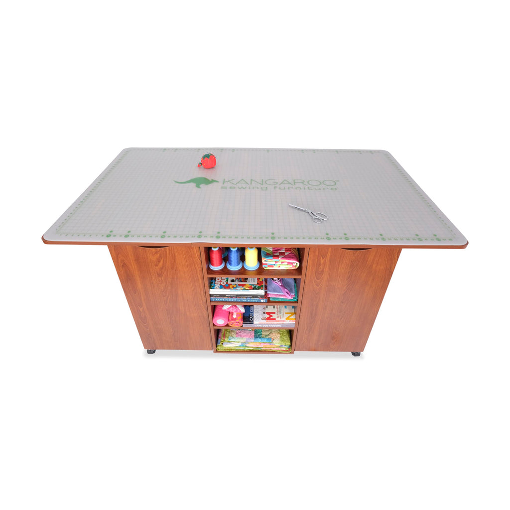 Kangaroo Kookaburra Cutting Table – Large Sewing, Quilting & Craft Workstation with Expandable 70” x 40” Surface, Storage Drawers, Shelves & Rolling Locking Casters, Teak Finish