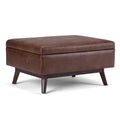 SIMPLIHOME Owen Coffee Table Storage Ottoman - 34" Wide x 19" High Upholstered Vegan Leather Rectangular Lift-Top Ottoman in Distressed Saddle Brown, Mid-Century Modern Bench with Tapered Legs
