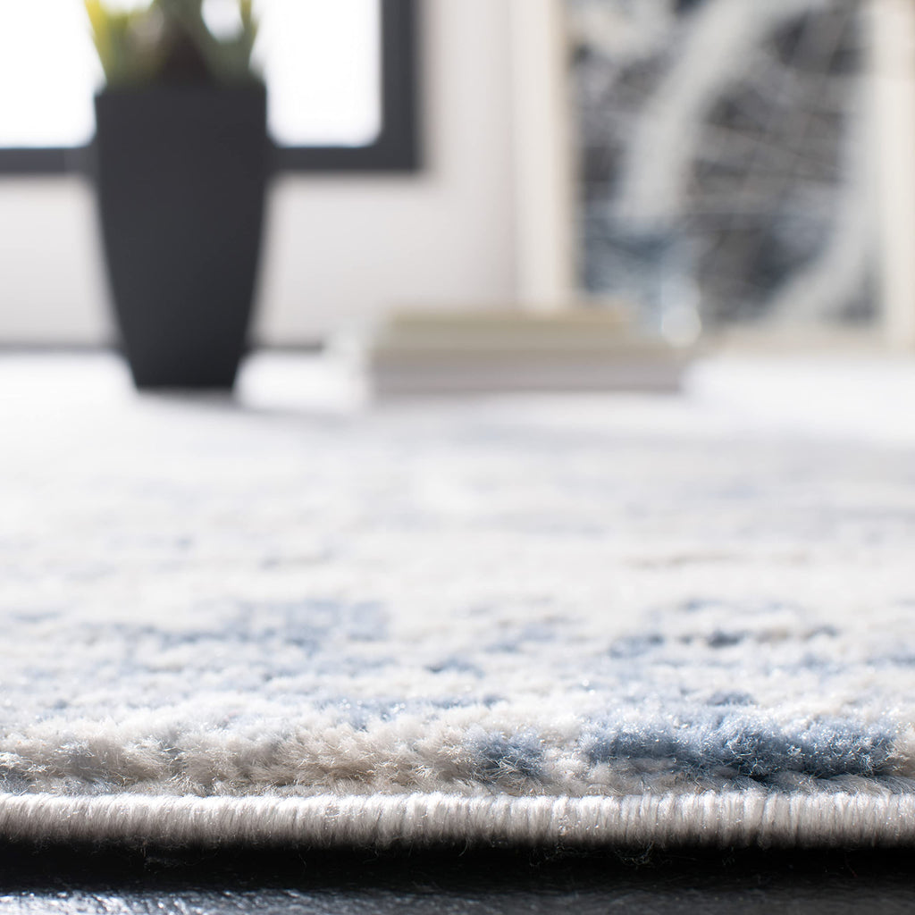 SAFAVIEH Amelia Collection Area Rug - 10' x 14', Ivory & Blue, Modern Abstract Design, Non-Shedding & Easy Care, Ideal for High Traffic Areas in Living Room, Bedroom (ALA700A)