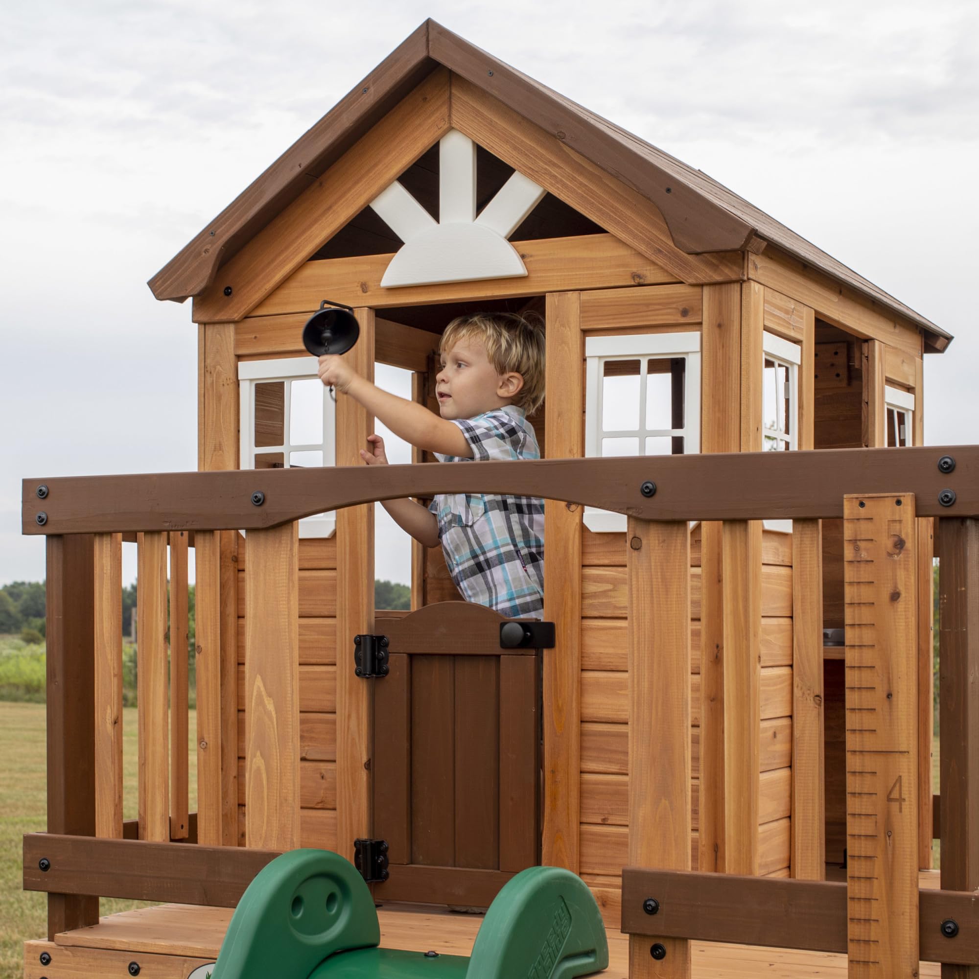 Backyard Discovery Echo Heights Elevated Cedar Wooden Kids Playhouse with Wave Slide, Play Kitchen, Wrap-Around Deck, Flat-Step Ladder, Half Door, Windows, Bell, and Growth Chart for Outdoor Play