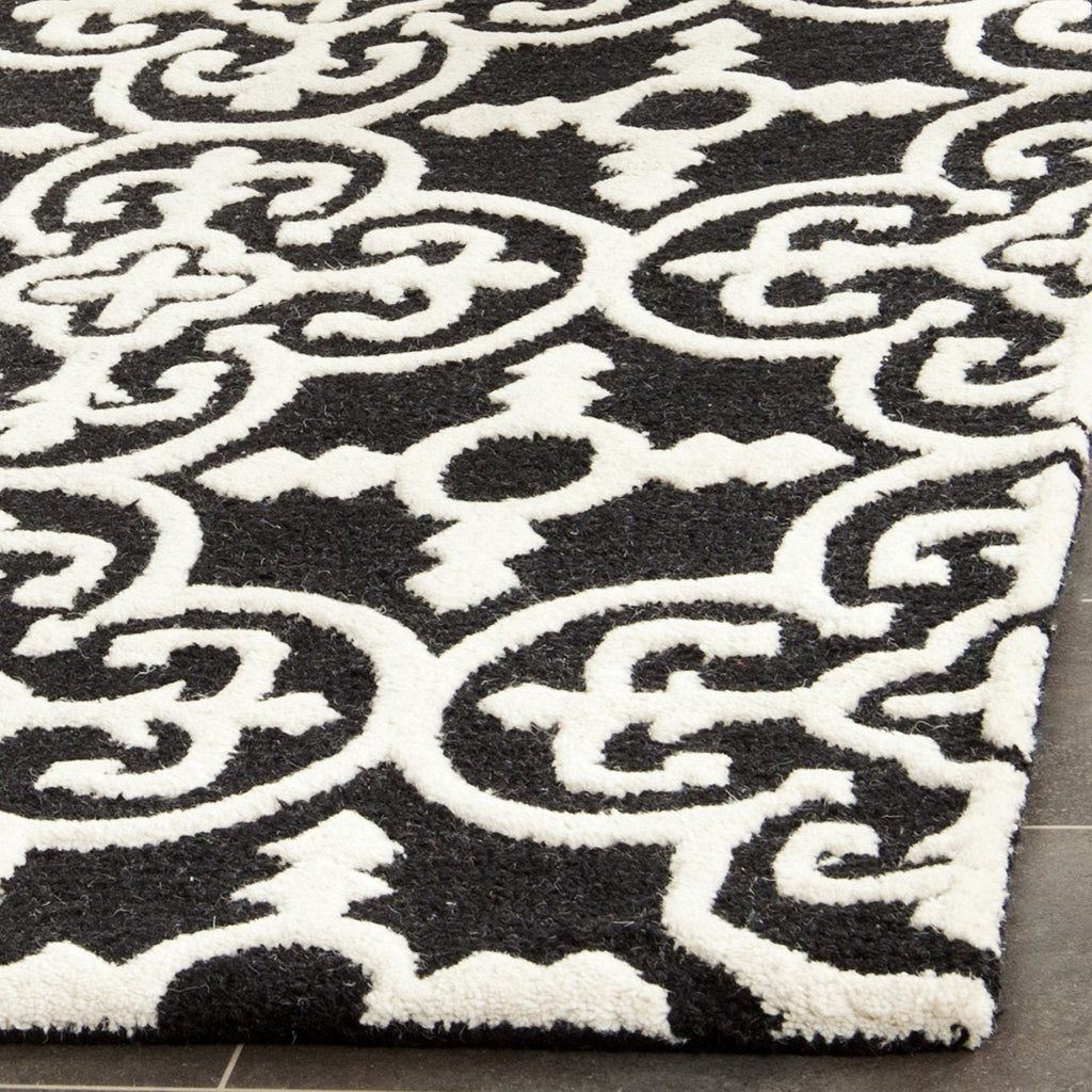 SAFAVIEH Cambridge Collection Area Rug - 9' x 12', Black & Ivory, Handmade Moroccan Wool, Ideal for High Traffic Areas in Living Room, Bedroom (CAM133E)