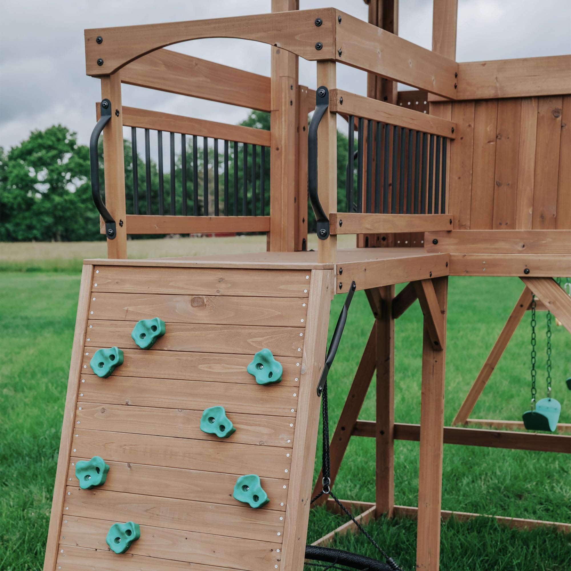 Backyard Discovery Sterling Point Cedar Wood Swing Set with Wave Slide, Raised Clubhouse, Wooden Bridge, Rock Wall, Belt Swings, Web Swing, Trapeze, Balcony, Climbing Wall, Ladder, Outdoor Playset