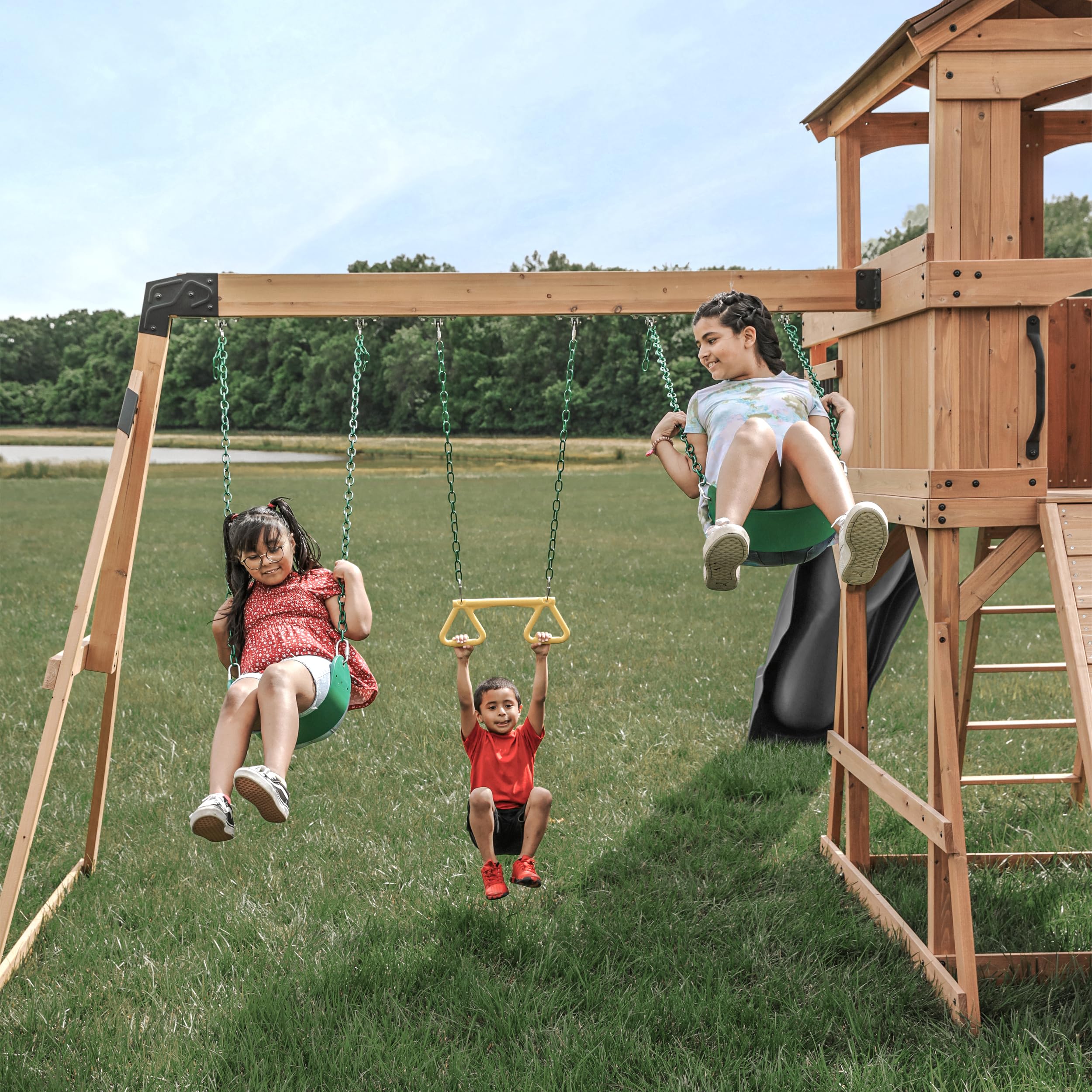 Backyard Discovery Sterling Point Cedar Wood Swing Set with Wave Slide, Raised Clubhouse, Wooden Bridge, Rock Wall, Belt Swings, Web Swing, Trapeze, Balcony, Climbing Wall, Ladder, Outdoor Playset