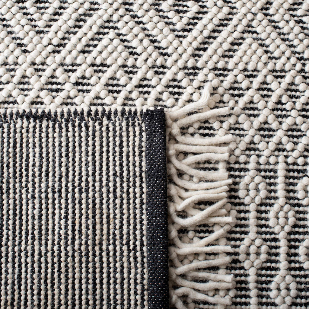 SAFAVIEH Natura Collection Area Rug - 9' x 12', Ivory & Black, Handmade Moroccan Boho Wool Fringe, Ideal for High Traffic Areas in Living Room, Bedroom (NAT852Z)
