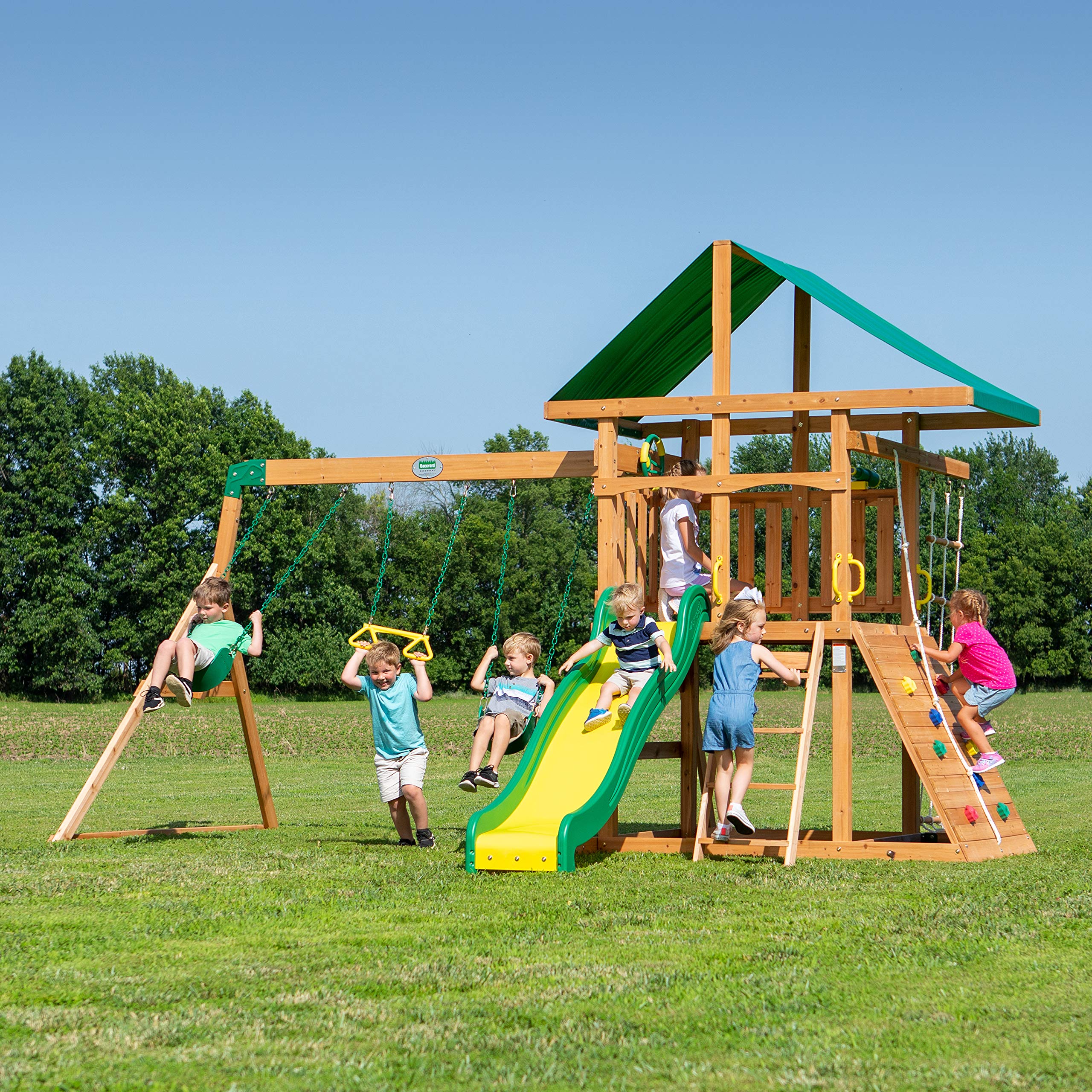 Backyard Discovery Mount Mckinley Cedar Wood Swing Set with Wave Slide, Play Deck, Double Rock Wall, Rope Ladder, Web Swing, Belt Swings, Toy Telescope, Steering Wheel, Sandbox Area, Outdoor Playset